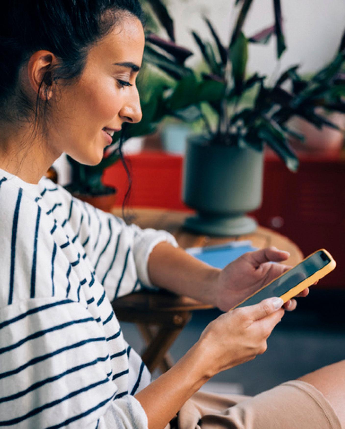 woman looking at her smartphone