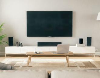 living room with tv, speakers, laptop