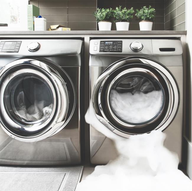 washer with soap suds overflowing