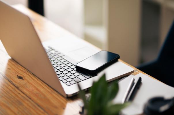 laptop and phone on table